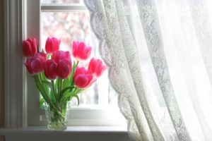 Brighten up your home's decor this springtime with fresh flowers and sheer curtains!